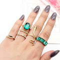 Wisdom's Coil: Minimalist Snake Ring with Emerald Eyes