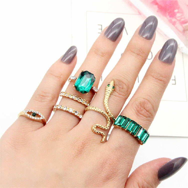 Wisdom's Coil: Minimalist Snake Ring with Emerald Eyes